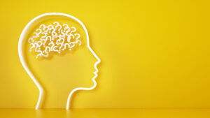 Bilde viser et omriss av et hode, med spørsmålstegn som symboliserer hjernen.