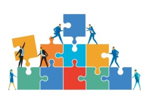 llustrasjon fra Shutterstock, som viser mennesker som samarbeider om å sette sammen puslespillebrikker