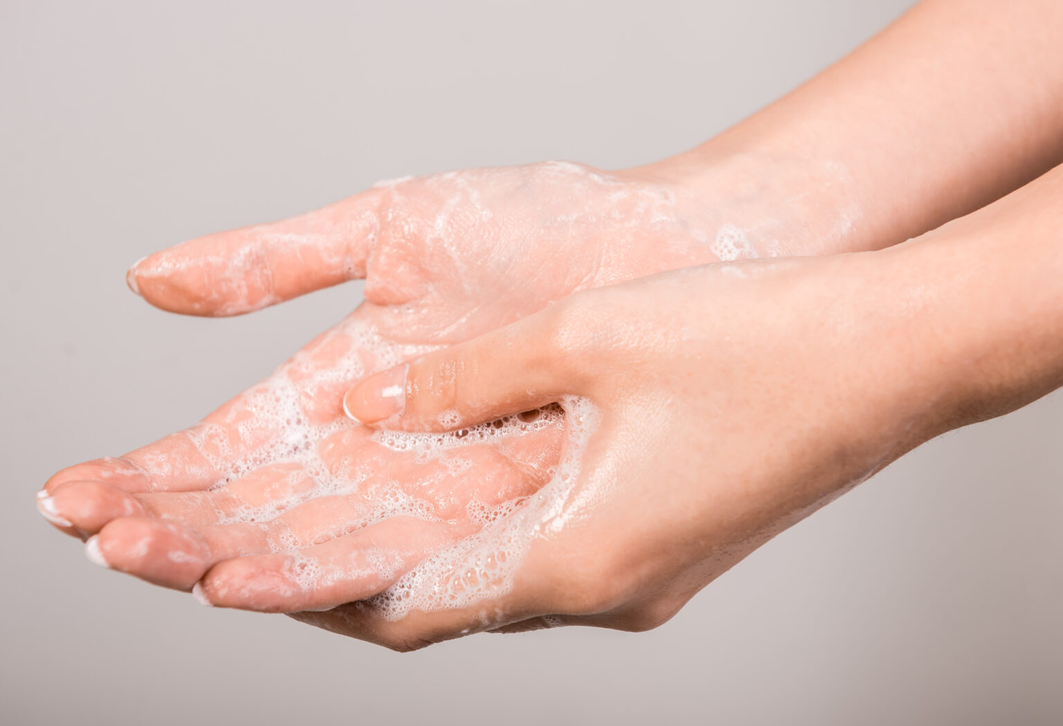 A,Woman,Washing,Her,Hands,With,A,Soap,Suds.