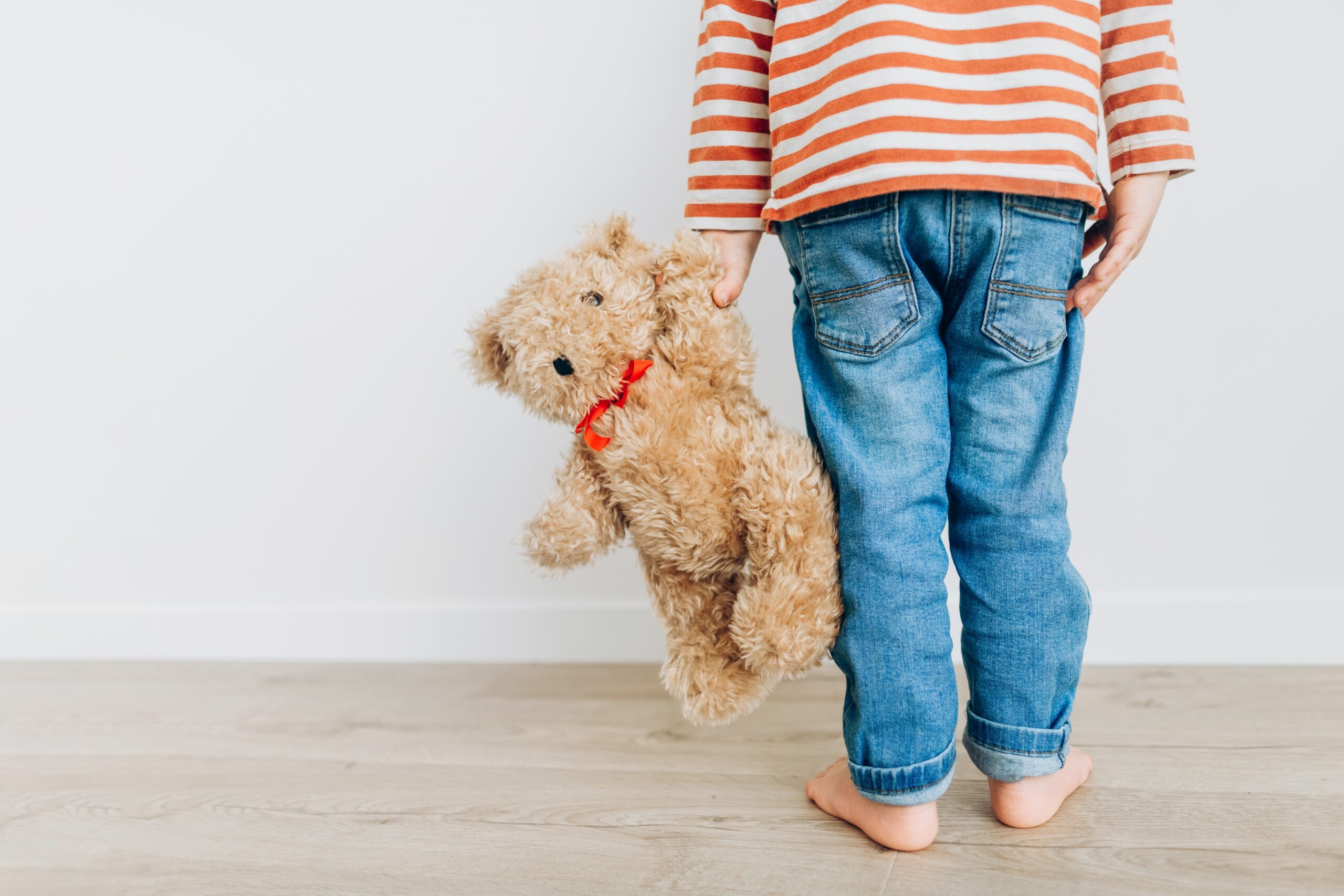 Little,Boy,Holding,His,Best,Friend,Teddy,Bear,Indoor