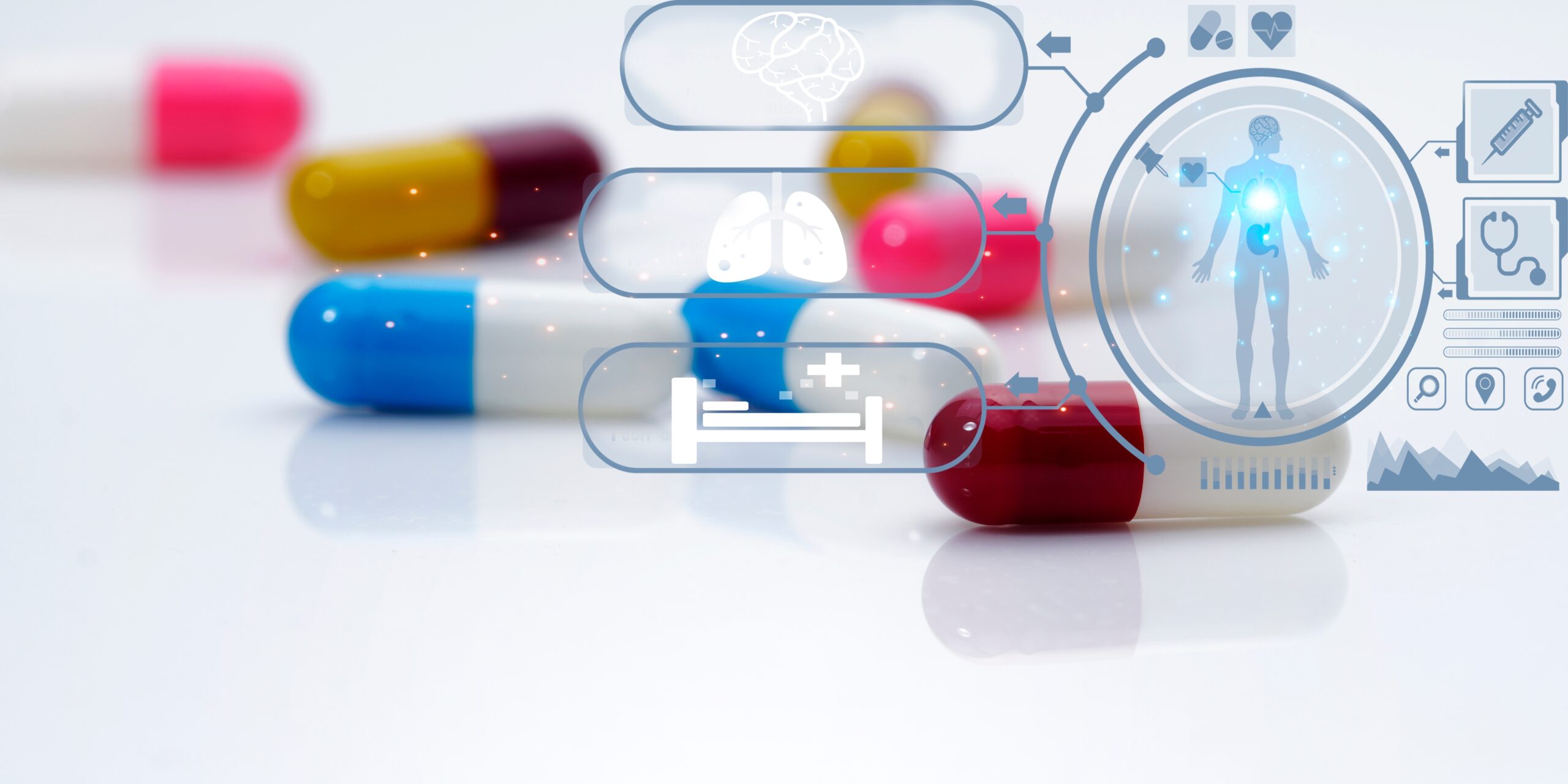 bildeillustrasjon/fotografi av piller liggende på hvit overflate. Pillene har forskjellige farger