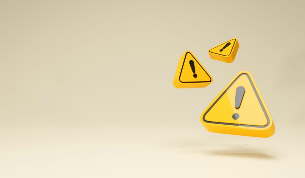 Blide viser 3 gule trekanter, med svart utropstegn i.